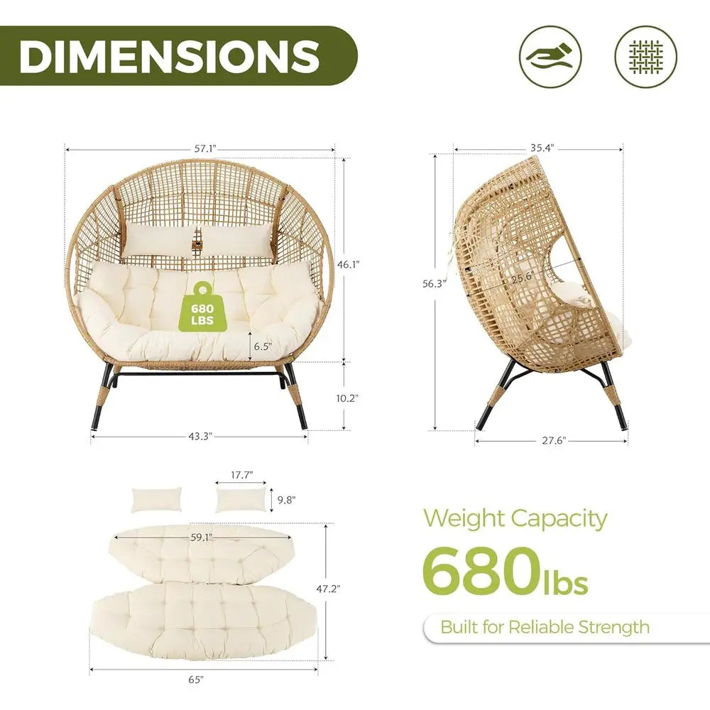 Oversized double egg wicker chair for 2 with cream cushions and metal legs, outdoor patio lounge