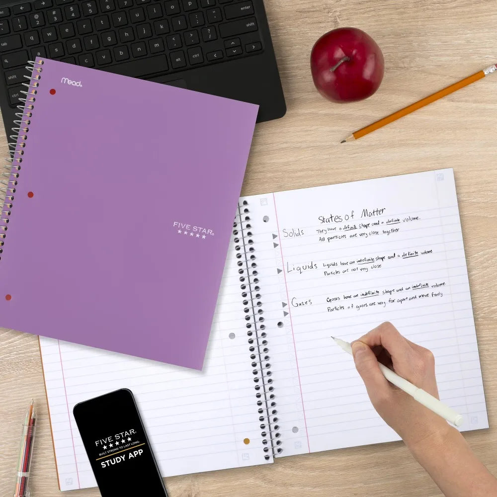 Spiral notebook amethyst purple Mead cover, 5-subject wide-ruled, 8 x 10.5 in, on desk with study app on smartphone