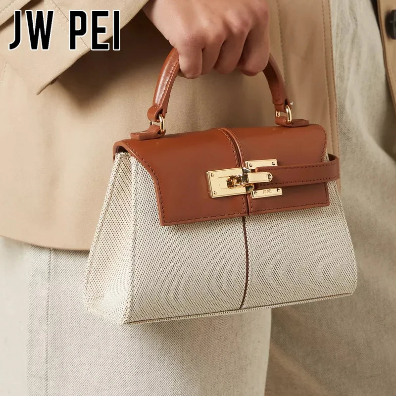 JW PEI Elise trapezoid top-handle bag with tan leather flap over beige fabric body and gold hardware