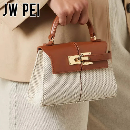 JW PEI Elise trapezoid top-handle bag with tan leather flap over beige fabric body and gold hardware