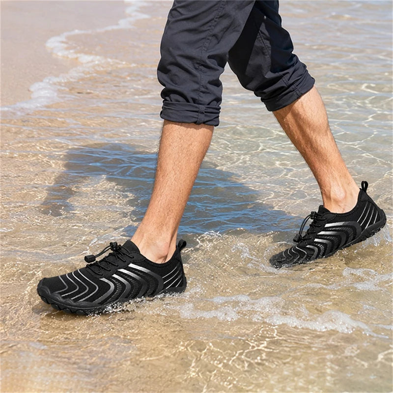 Men's water shoes by S And B Enterprise, black quick-dry sneakers with zigzag stripes on the beach.