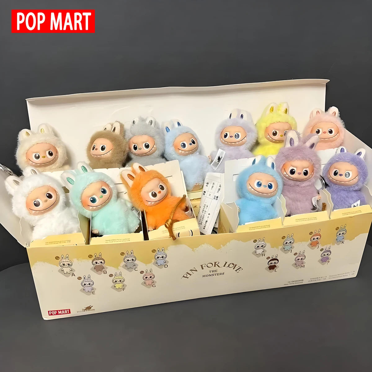 Labubu plush dolls by POP MART in pastel colors displayed in a display box