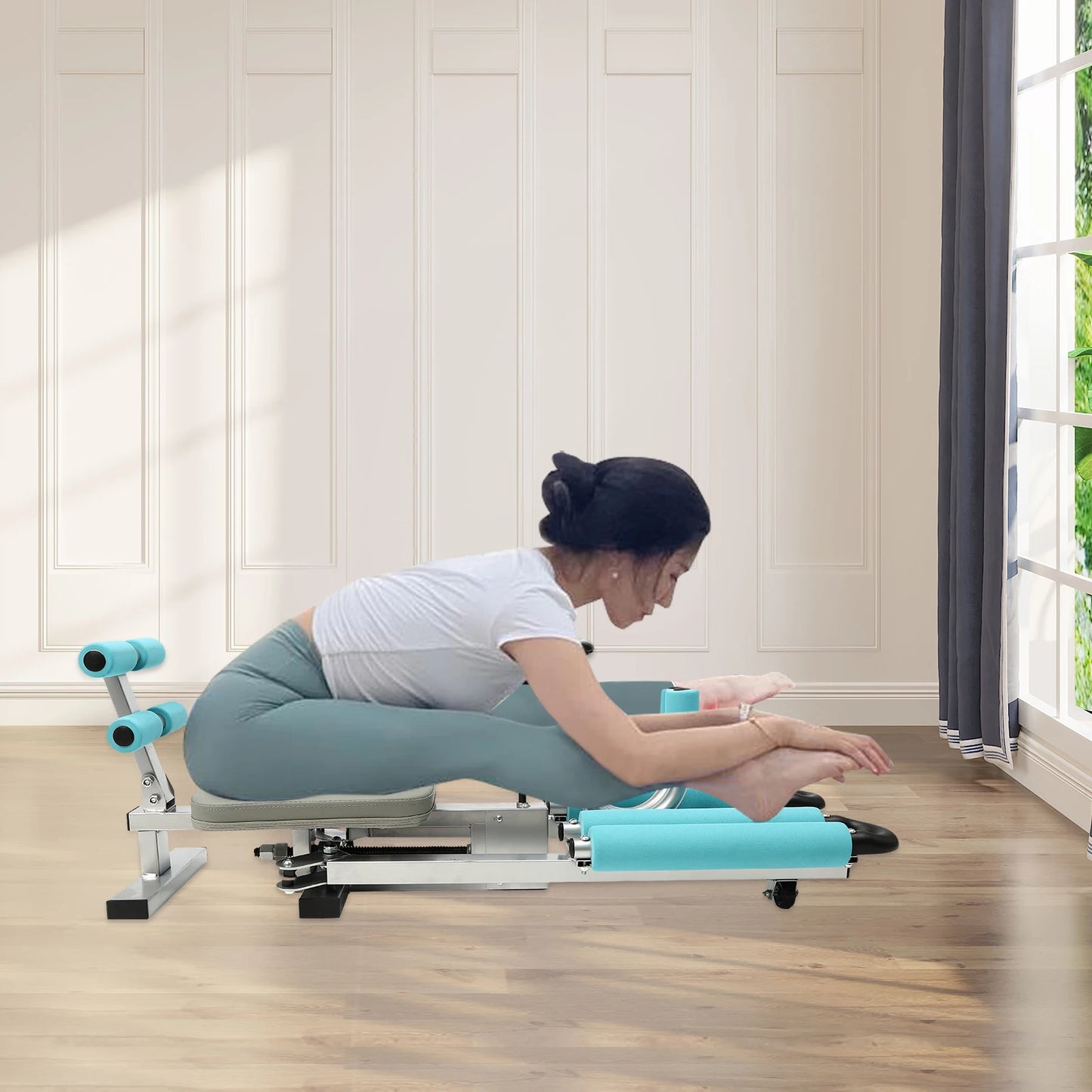 Leg stretcher split machine with teal padding and metal frame for home gym use by S And B Enterprise