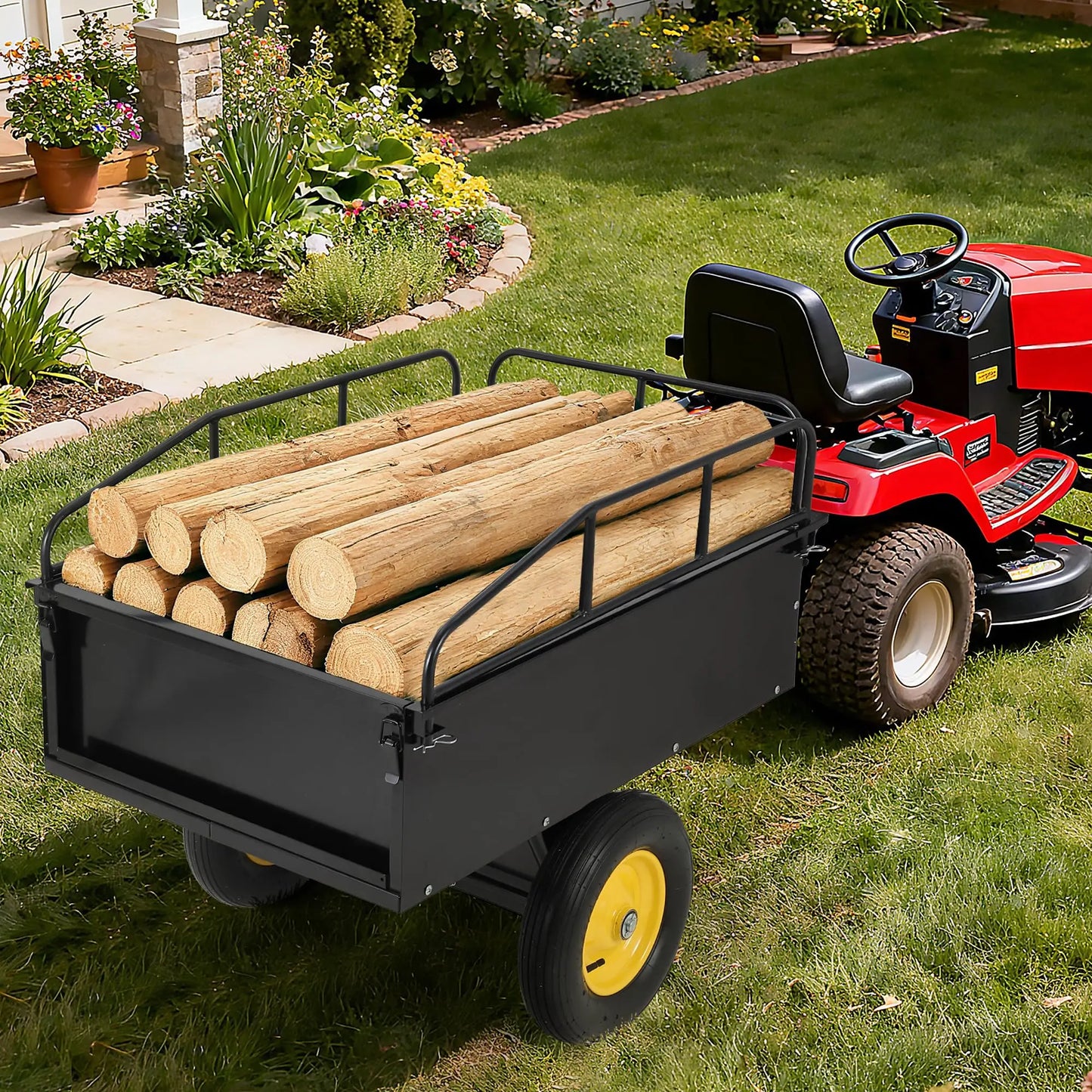 Black steel dump cart attached to a red lawn tractor, loaded with cut logs in a yard