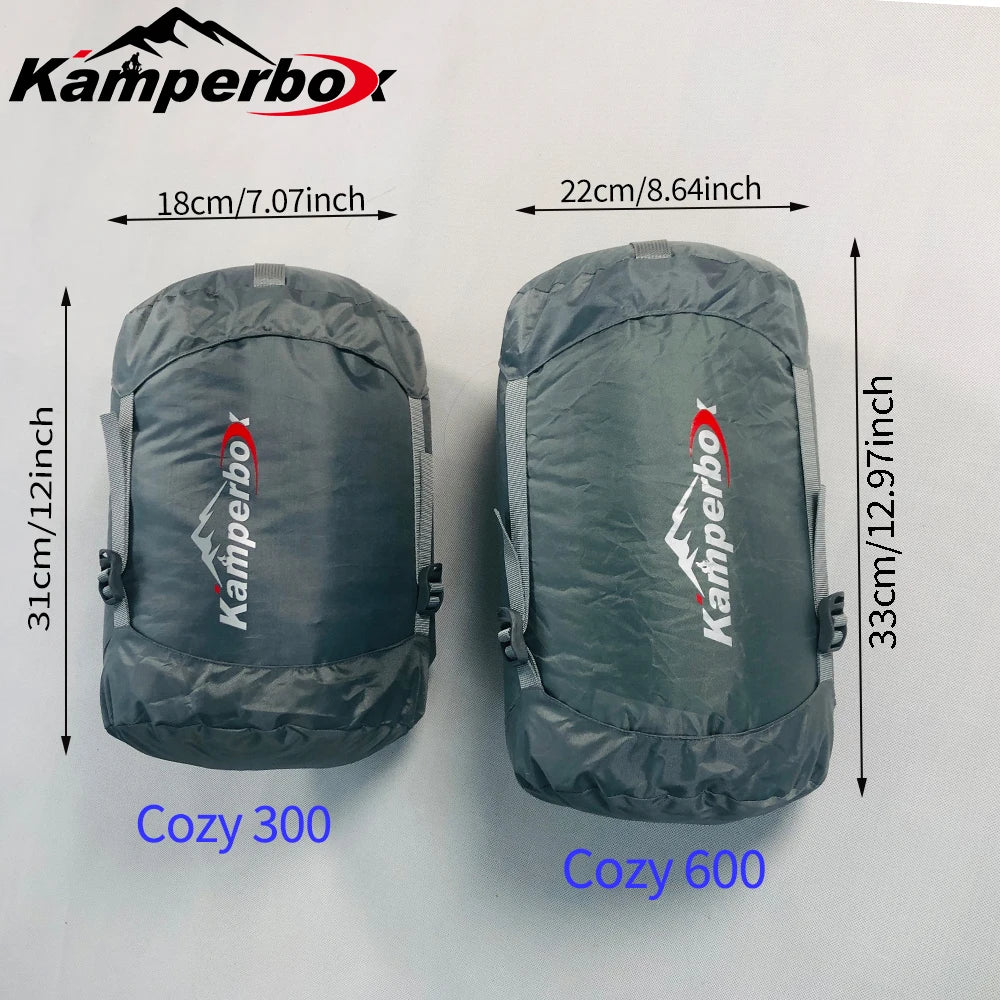 Kamperbox Cozy 300 and Cozy 600 down sleeping bags, two gray ultralight winter camping bags by S And B Enterprise