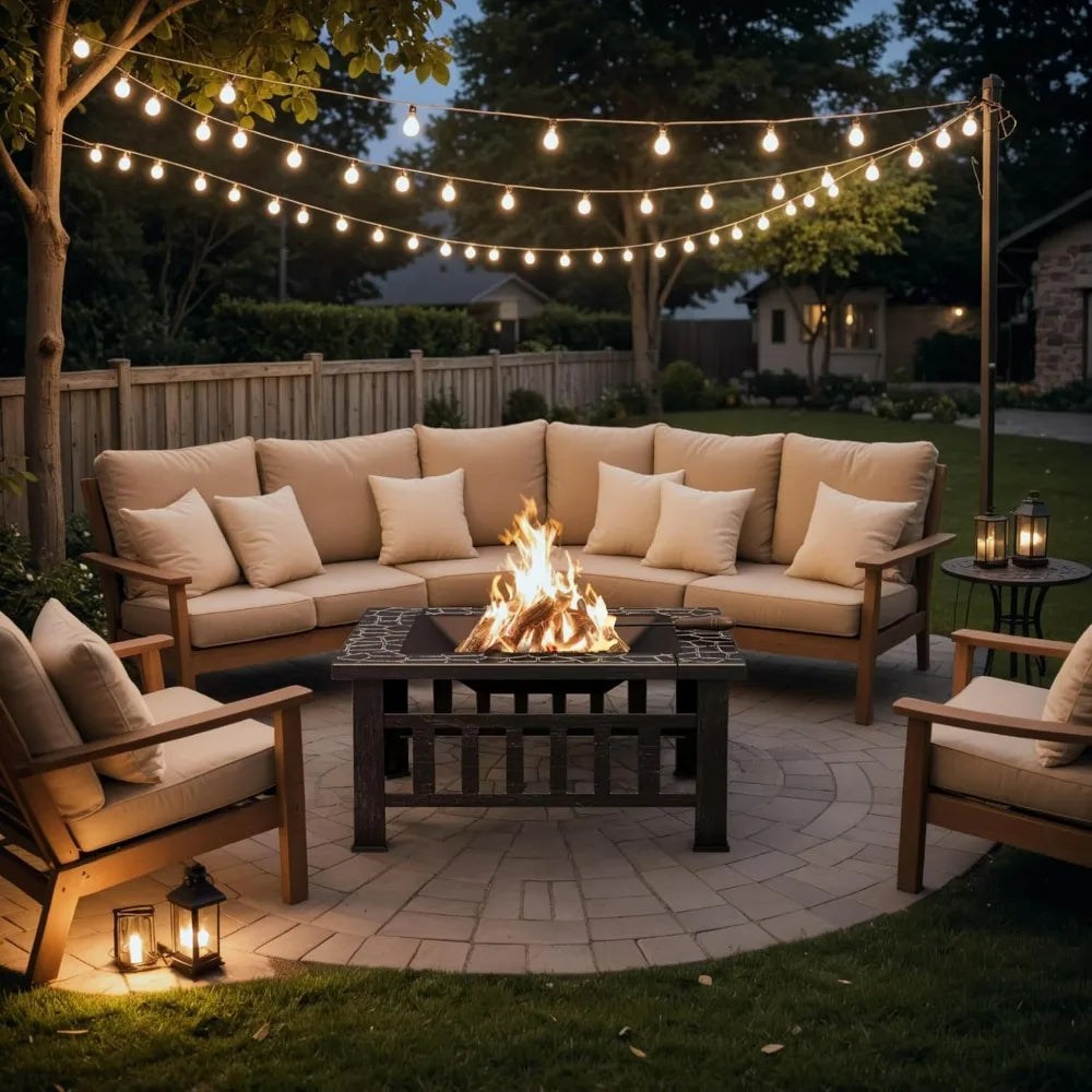 Devoko 32-inch metal outdoor fire pit table surrounded by a beige cushioned patio seating group under string lights.