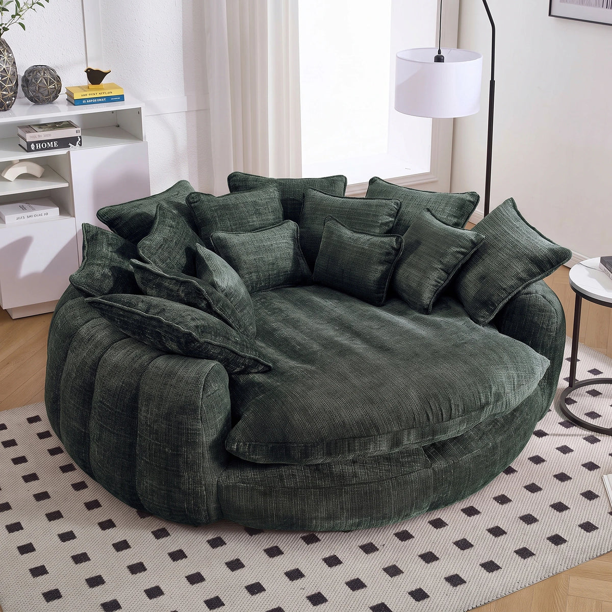 Cloud couch sleeper sofa by S And B Enterprise in dark green chenille with 14 pillows, oversized rounded chaise.