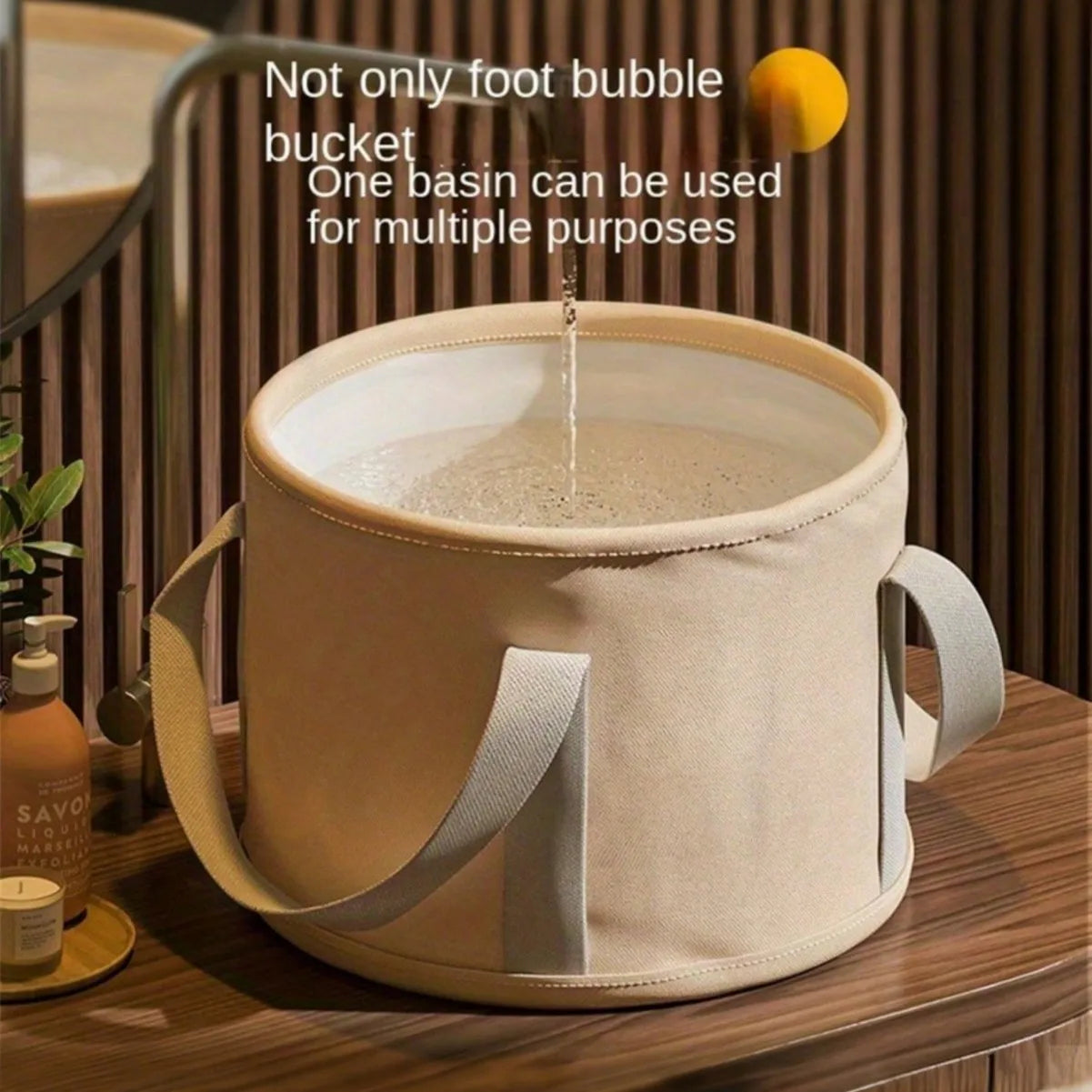 Foldable beige foot soak tub with dual handles, round deep basin, heat-preserving design.