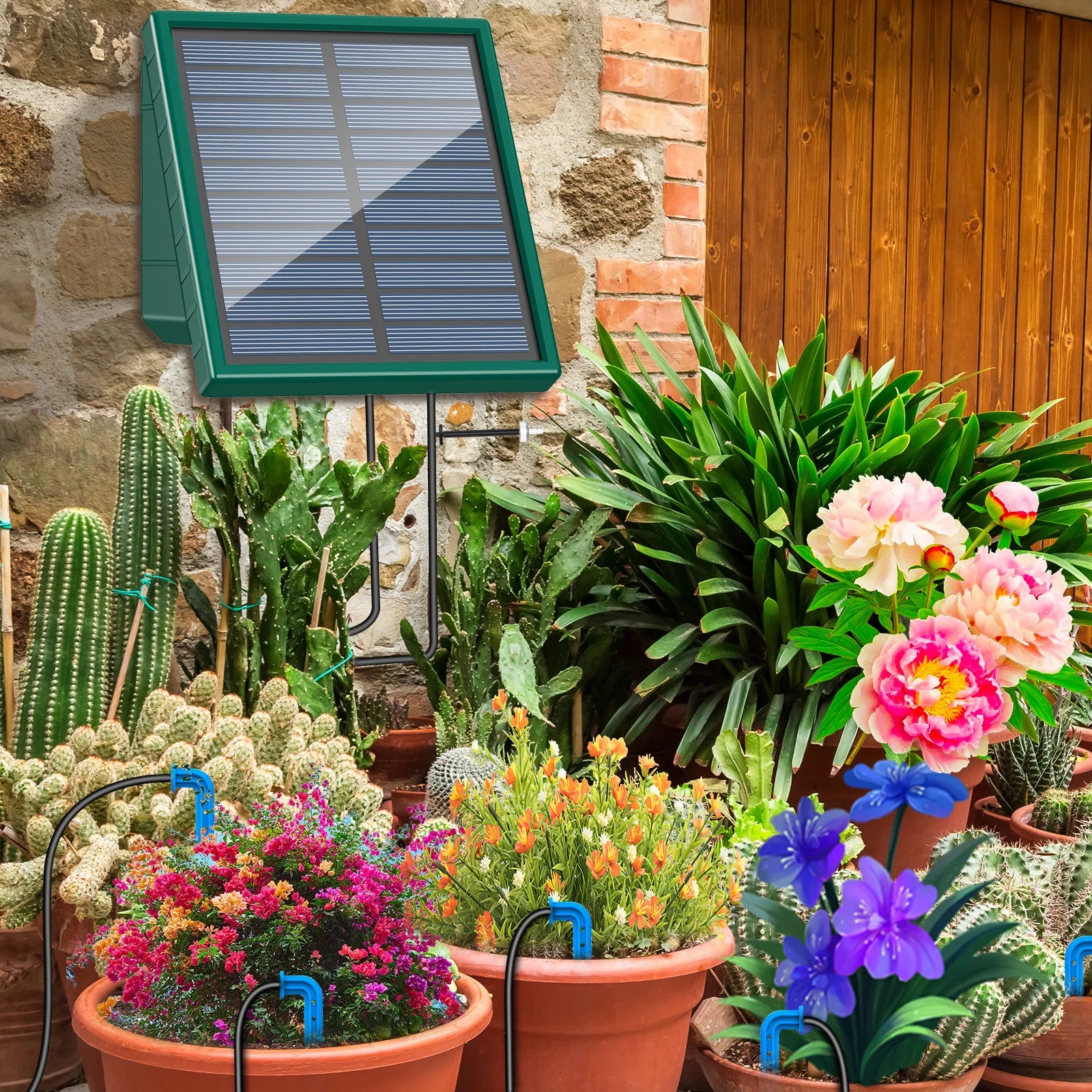 Solar drip irrigation system with green solar panel mounted on a stand in a garden beside flowering potted plants
