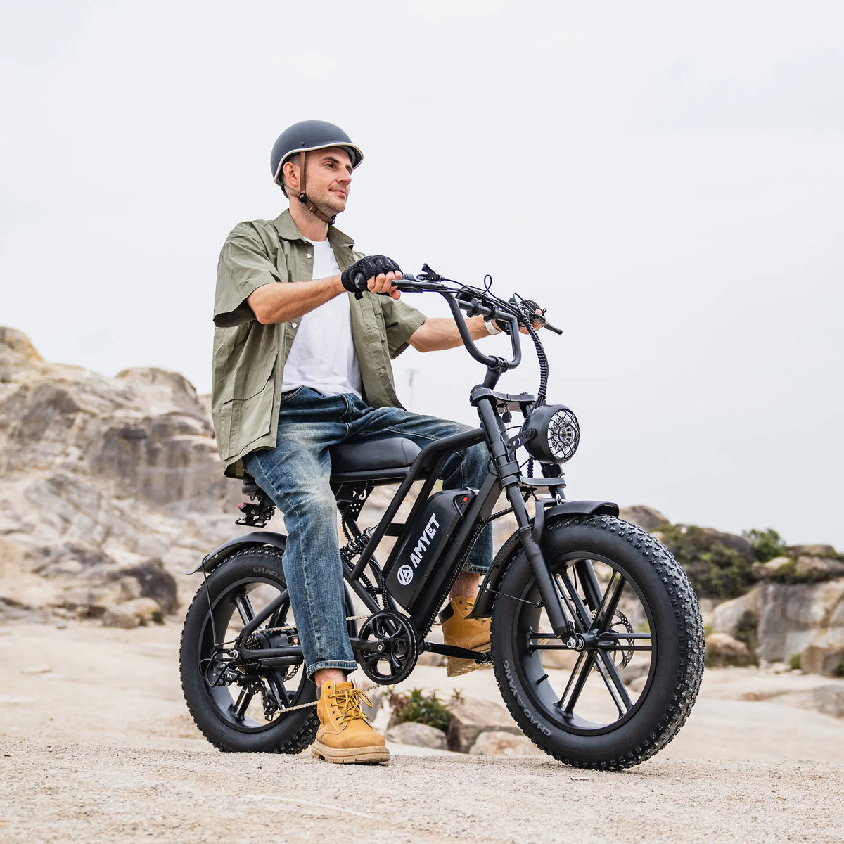 AMYET V9-G60 adults electric bike with 1000W motor, black frame on rocky trail