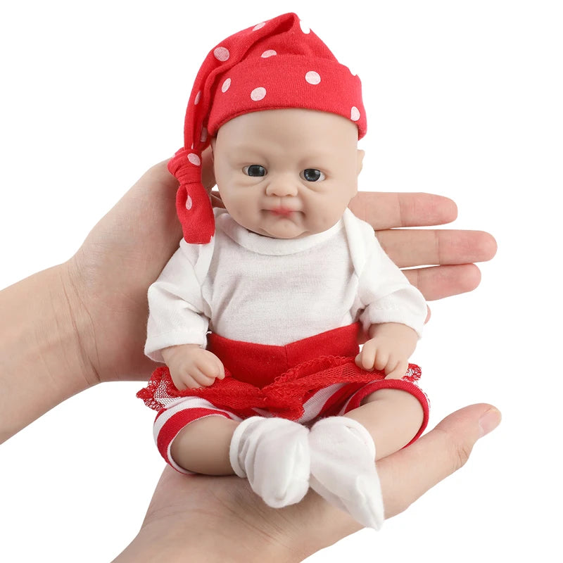 IVITA silicone reborn baby doll, lifelike newborn girl in red and white outfit with polka-dot headscarf