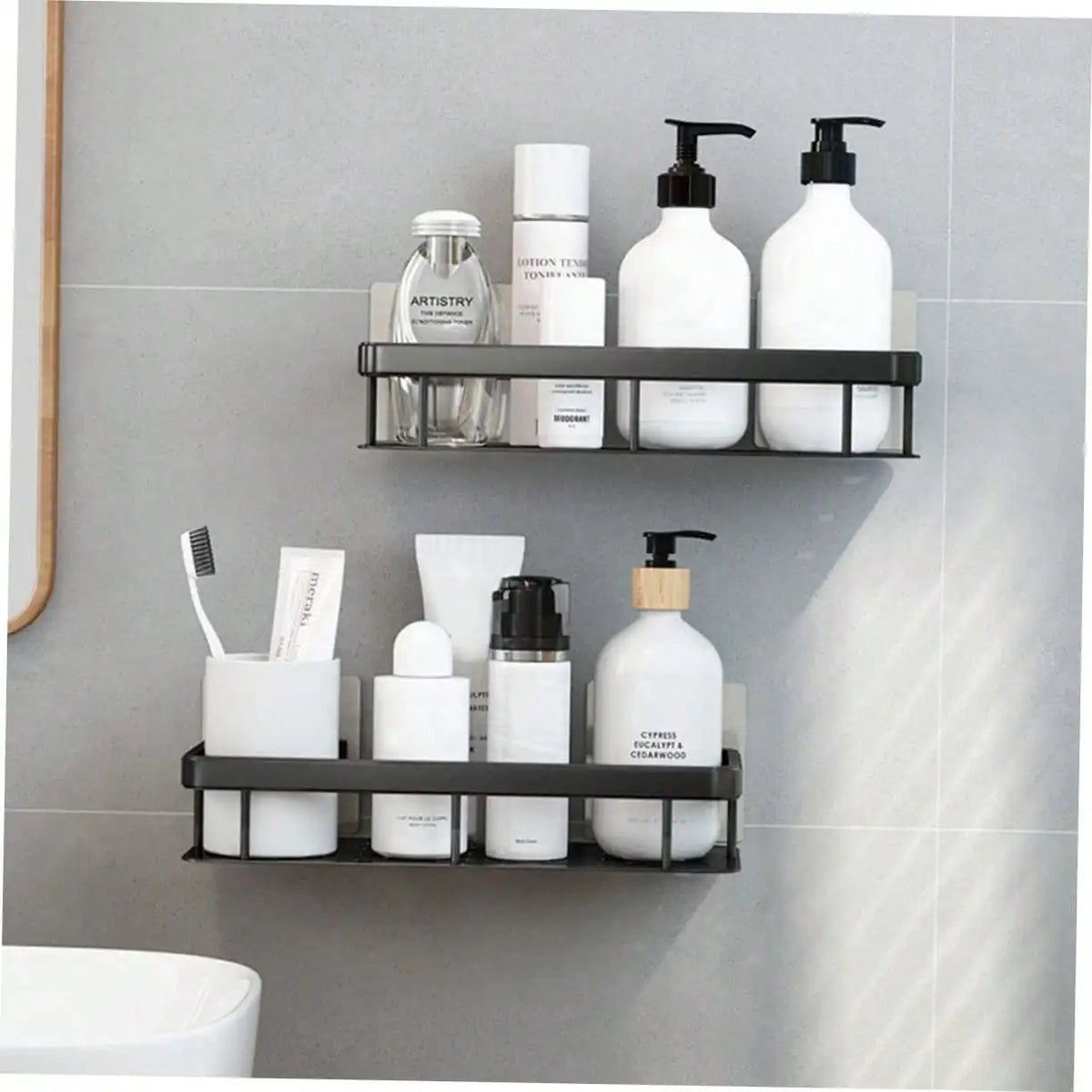 Drill-free wall-mounted bathroom storage shelf, black aluminum two-tier rack for shampoo bottles and toiletries.