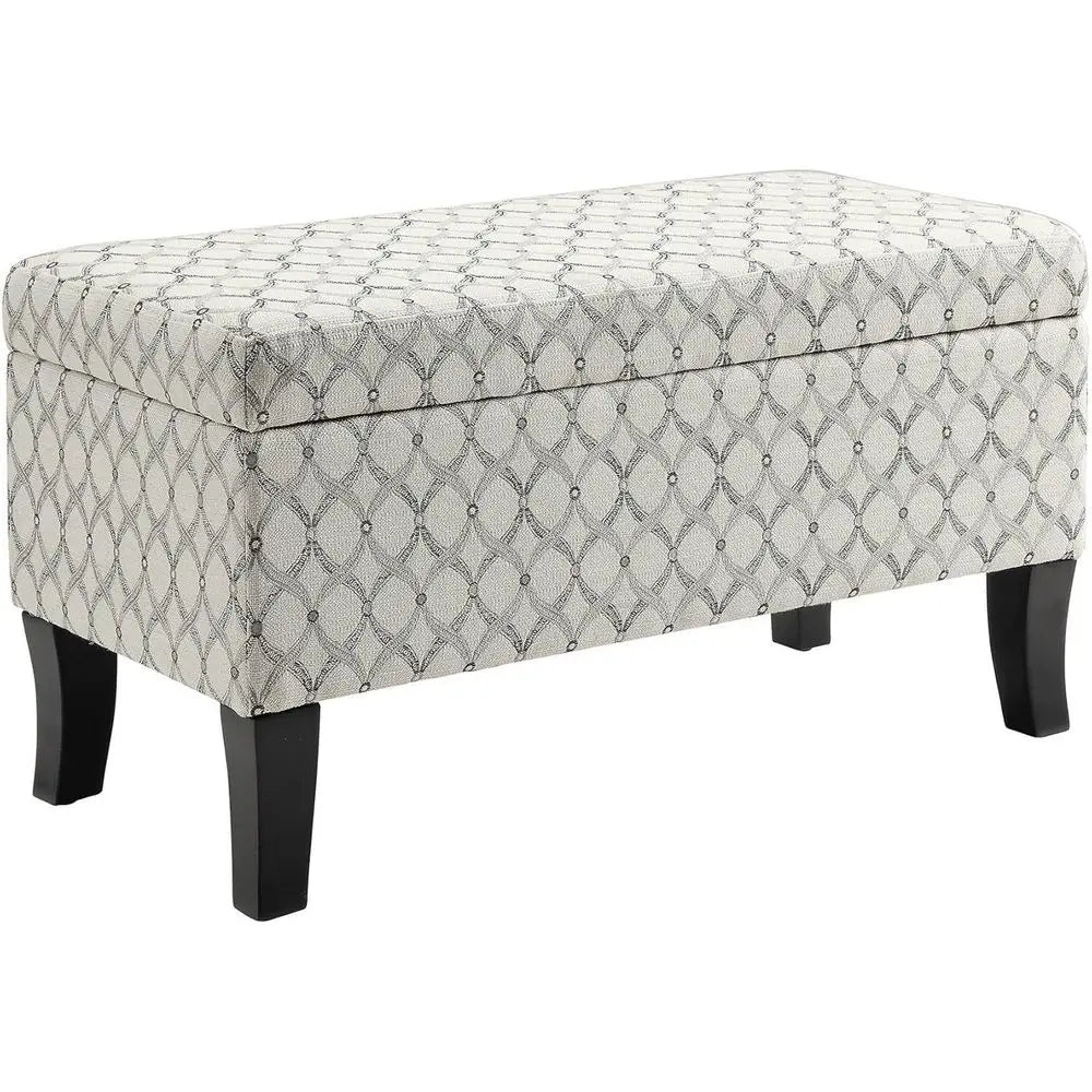 Storage ottoman with cream-gray ribbon-patterned upholstery and black wooden legs by S And B Enterprise.