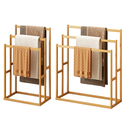 Two wood vertical towel racks with three hanging crossbars and neutral towels.