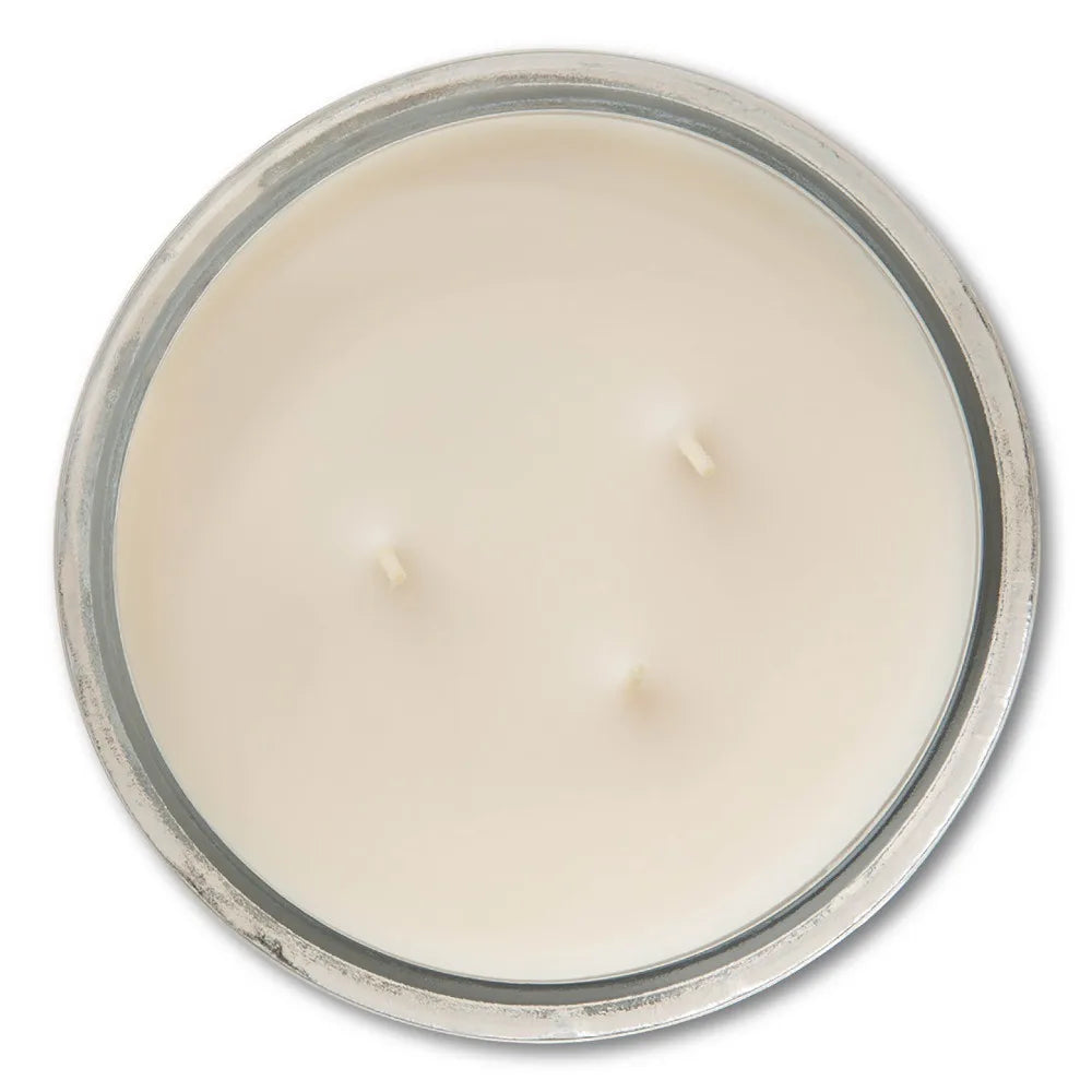 Vanilla scented glass jar candle, 3-wick, ivory wax in a clear jar with a metal rim