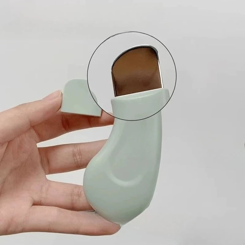 1pc silicone nose blackhead remover tool with mint green handle and metal scraper blade