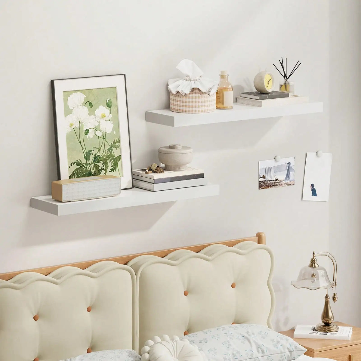 Floating Shelves Set of 2, 22-inch white MDF wall shelves with decor in a bedroom