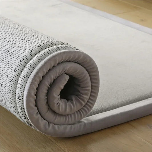 Soft padded baby play mat by S And B Enterprise; gray top with rolled cushion edge.
