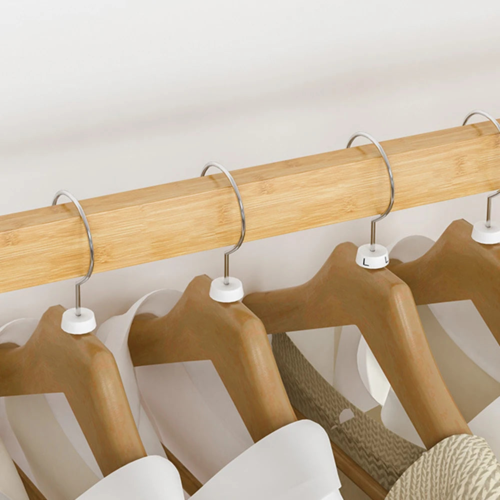 Bamboo clothes rail rack with double hanging rails and several wooden hangers