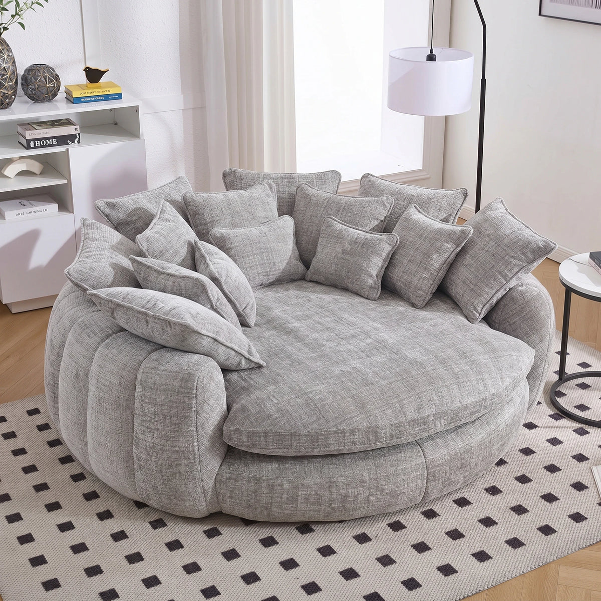 Cloud couch sleeper sofa in gray chenille with an oversized round chaise and plush pillows.