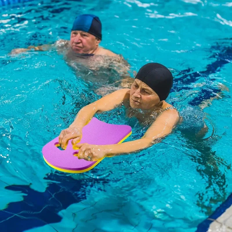 Kickboard swimming training EVA foam U-shaped board in pink with yellow edge for kids and adults in pool.