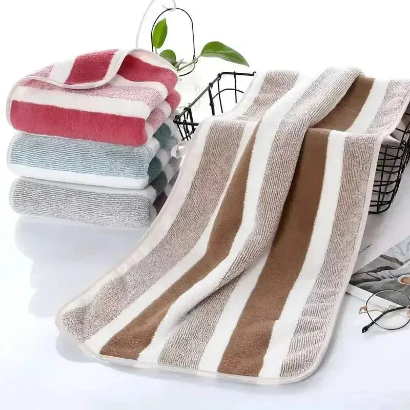 Ultra soft bath towel set by S And B Enterprise; plush cotton blend with beige-brown striped towels.