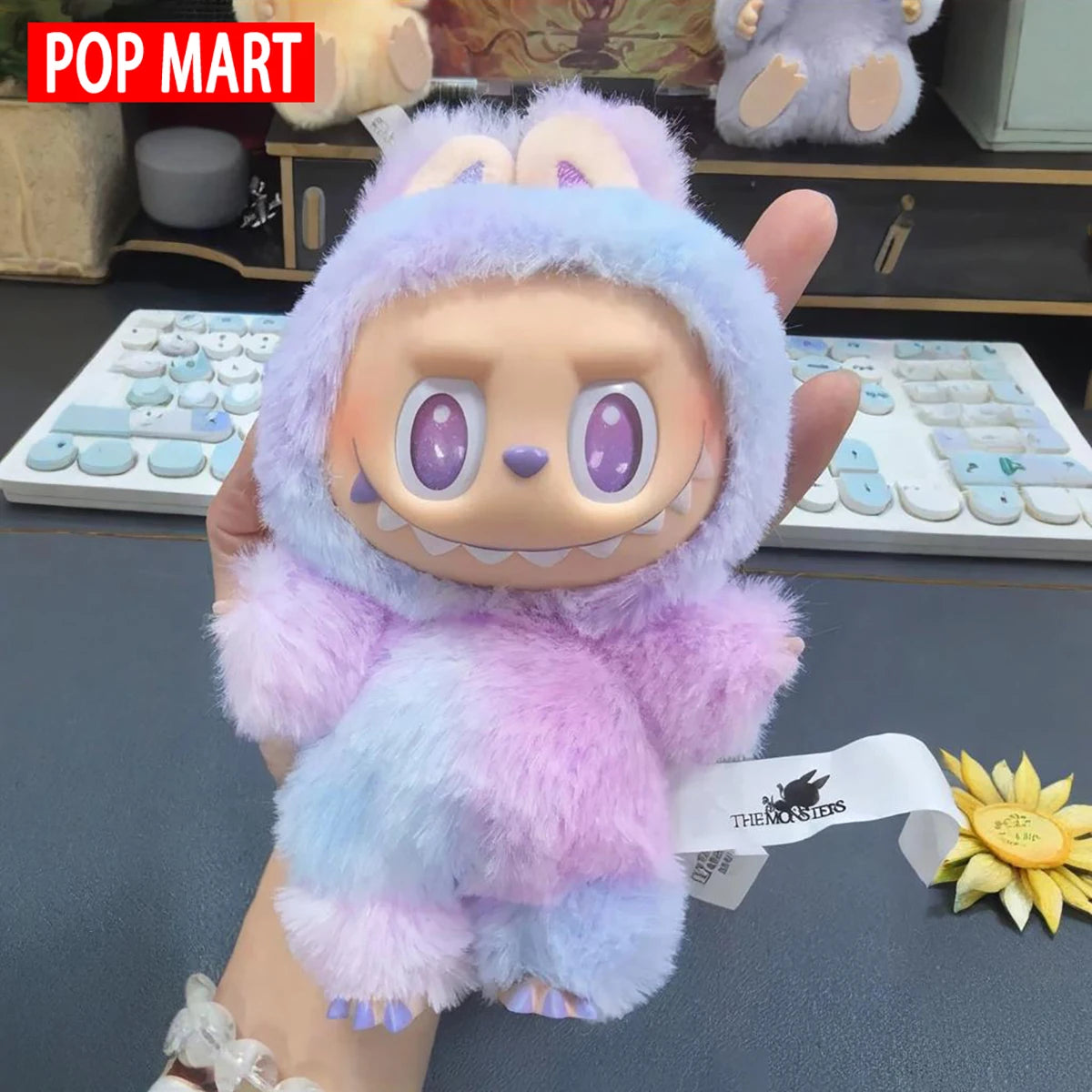 Labubu plush doll in pastel macaron colors (purple, pink, blue) by POP MART.