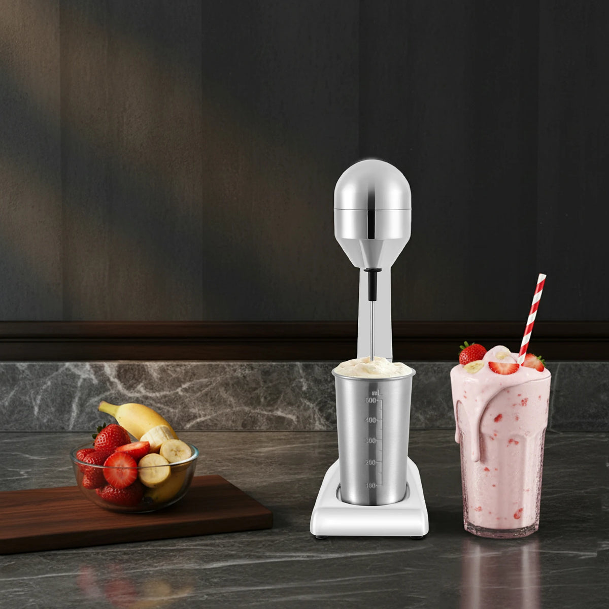 Milkshake maker with 100W motor; chrome and white blender with 500ml cup, strawberry milkshake displayed.