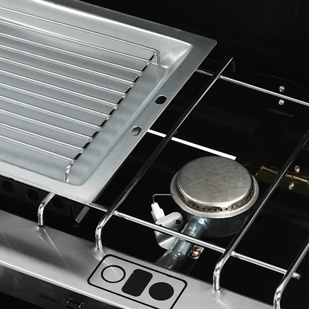 Portable table-top camping stove by S And B Enterprise with stainless steel grill rack and single burner.