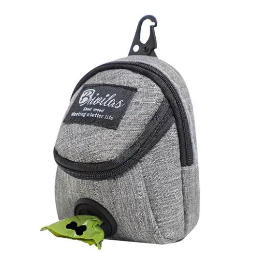 Portable dog treat bag in gray fabric with waist bag design and built-in poop bag dispenser