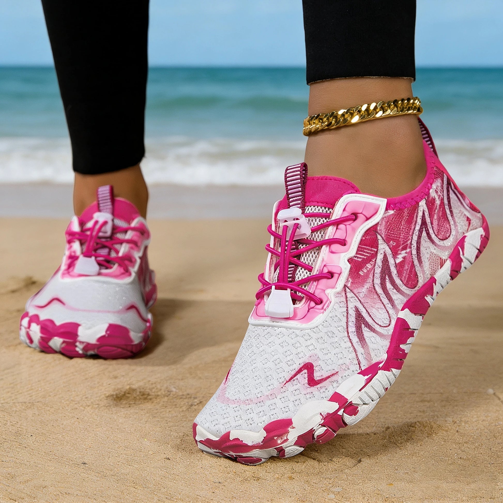 Women quick-dry barefoot water shoes in pink gradient with white soles; two on a sandy beach.