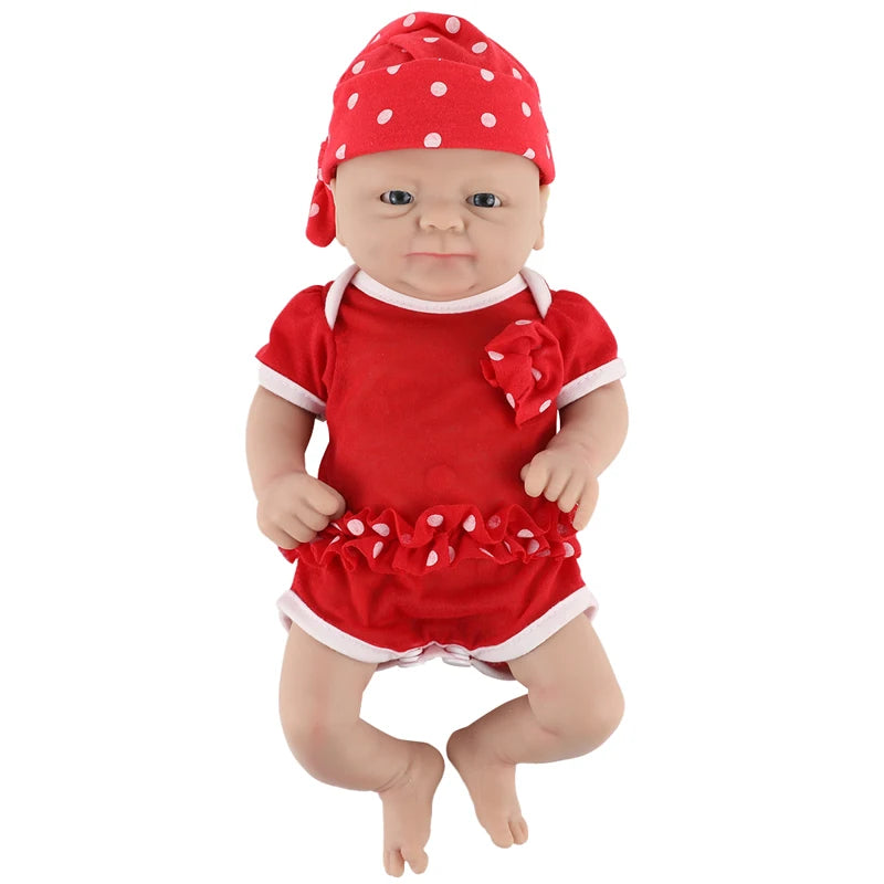 Silicone reborn baby doll girl in red outfit with white trim and polka-dot hat by S And B Enterprise