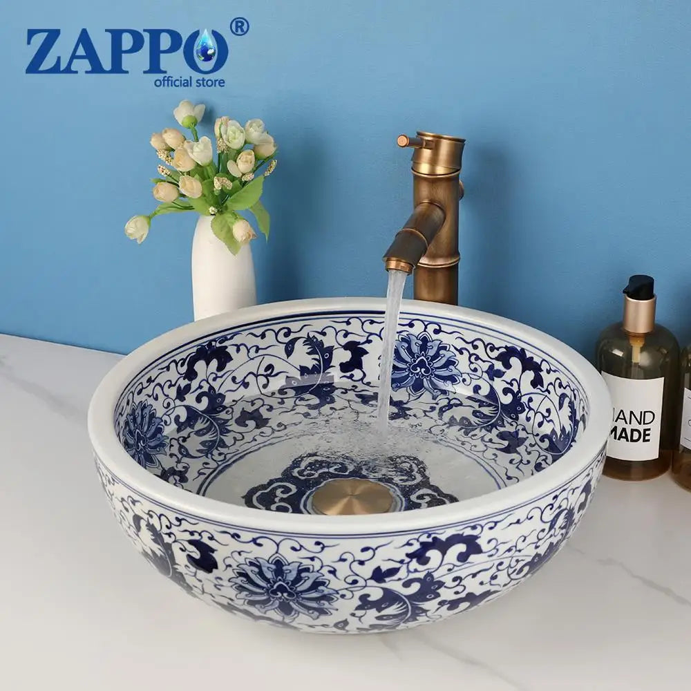 Ceramic round bathroom vessel sink with copper mixer faucet and blue floral pattern, ZAPPO.