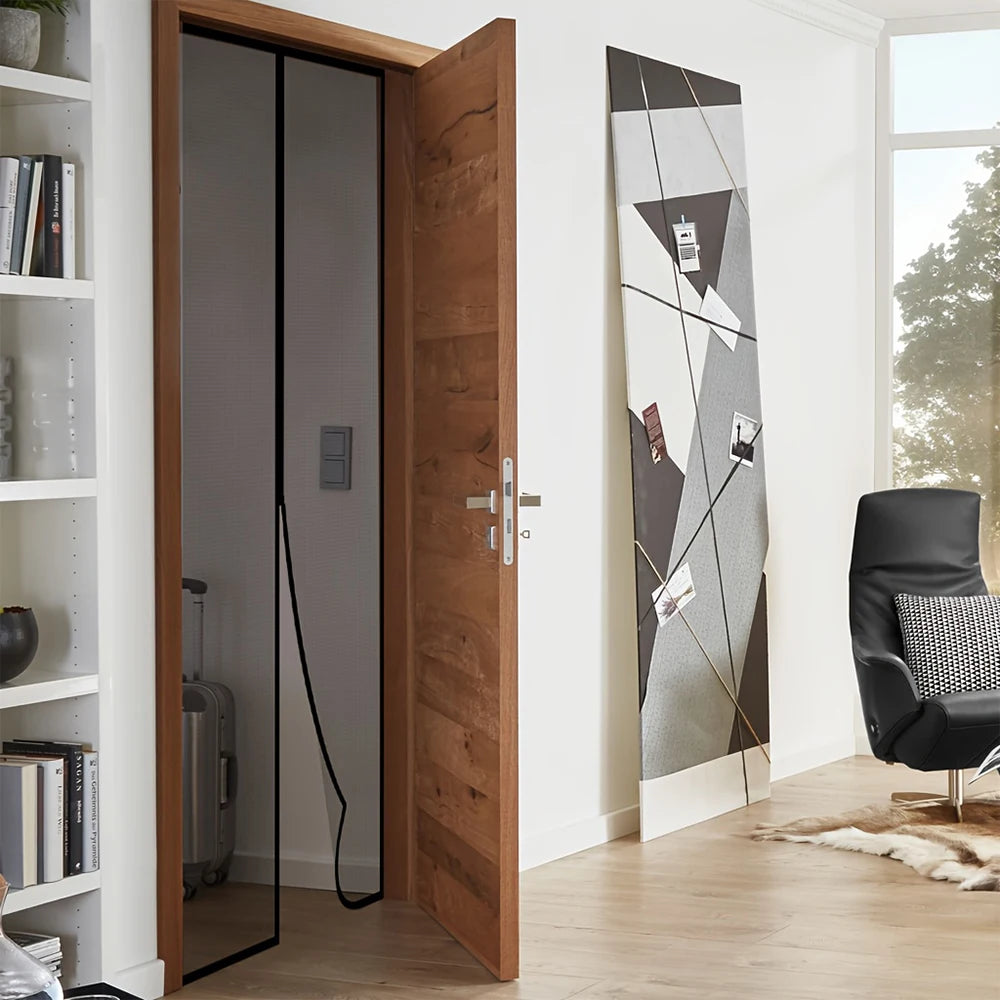Heavy-Duty Retractable Screen Door by S And B Enterprise with seamless mesh in doorway