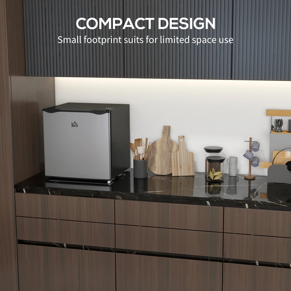HOMCOM mini countertop freezer, 1.1 cu ft, silver with removable shelves, on black marble kitchen counter