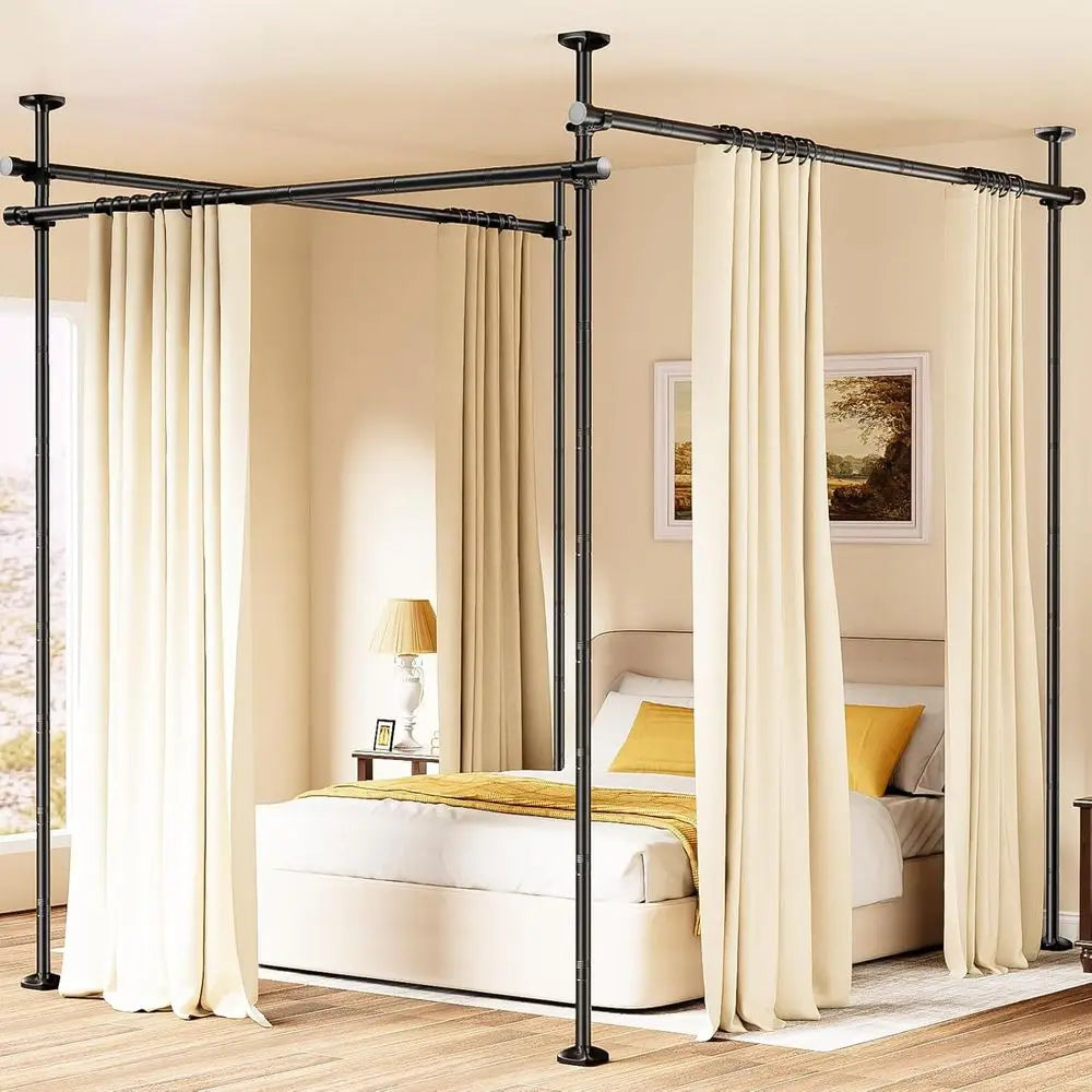 Room divider curtain rod system by S And B Enterprise; black adjustable tension rods with cream curtains around a bed.