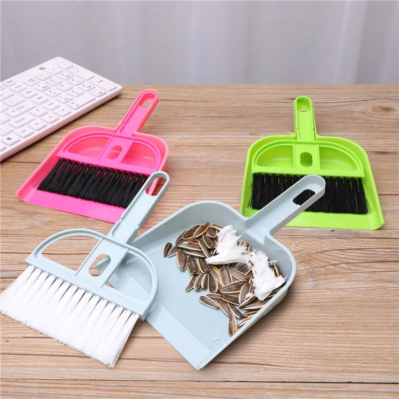 Three mini desk broom and dustpan sets in pink, blue, and green by S And B Enterprise.
