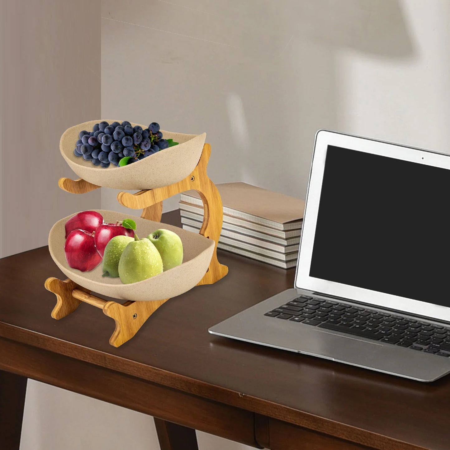 Two-tier fruit stand with natural wood frame and beige bowls; blueberries on top, apples and pears on bottom.