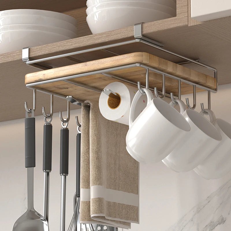 Under-cabinet stainless steel kitchen organizer with hanging hooks for mugs and utensils, plus a wooden cutting board