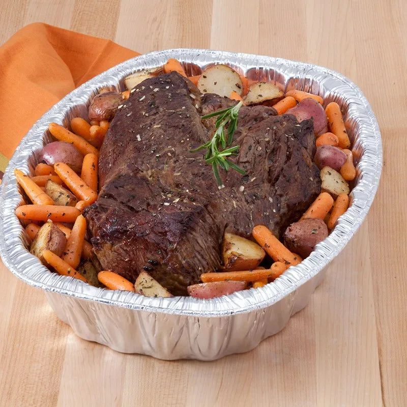 Super King aluminum extra-deep oval roaster pan with beef roast, carrots and potatoes.
