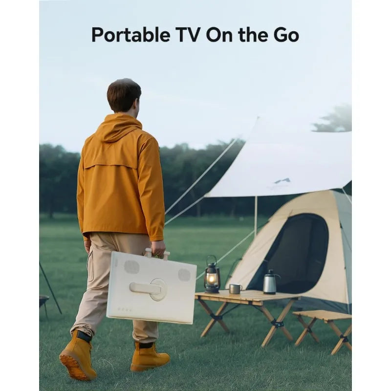 Portable Android TV on the go carried in a white case by a man in an orange jacket at a campsite with a tent.