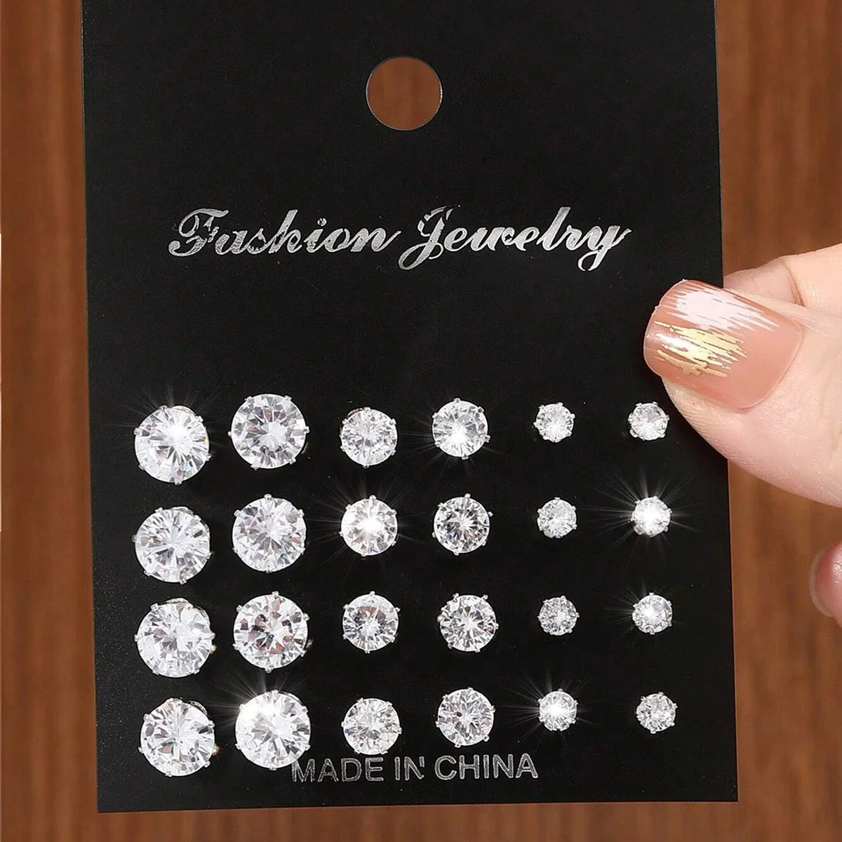 12 pairs of clear zirconia stud earrings by S And B Enterprise; shiny fashion jewelry set