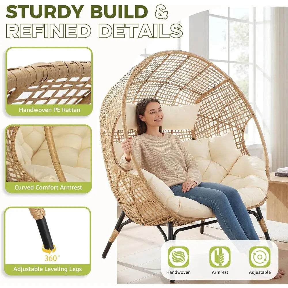 Oversized 2-person wicker egg chair in natural handwoven PE rattan with cream cushions