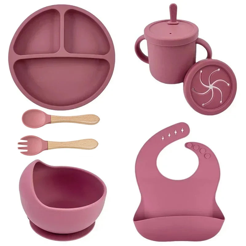 Pink silicone child dish set with 6 pieces: divided plate, bowl, bib, sippy cup with lid and straw, spoon and fork