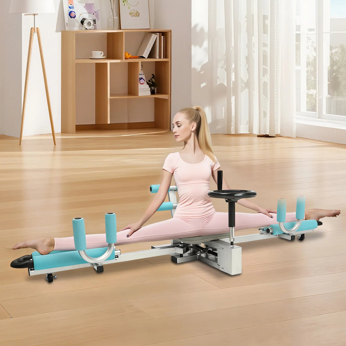 Leg stretcher machine with turquoise padding, adjustable 0–210° for ballet and yoga stretches.
