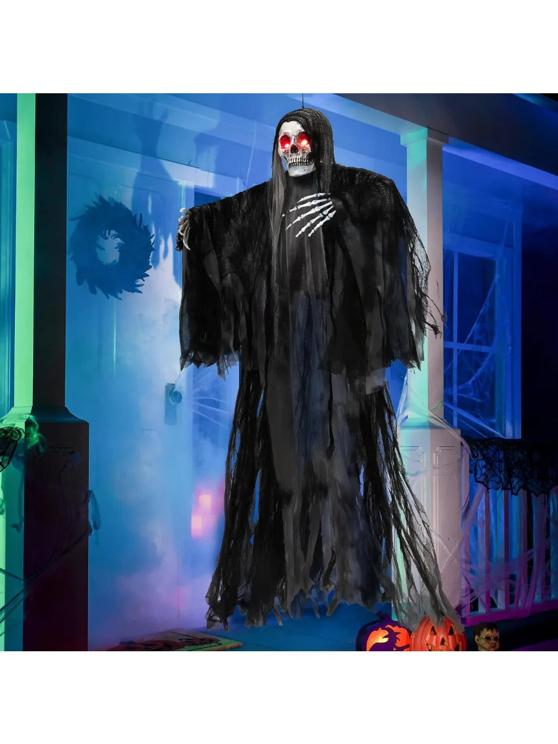 59-inch hanging Grim Reaper Halloween prop with glowing red eyes, skeletal hands, tattered black robe on a porch.