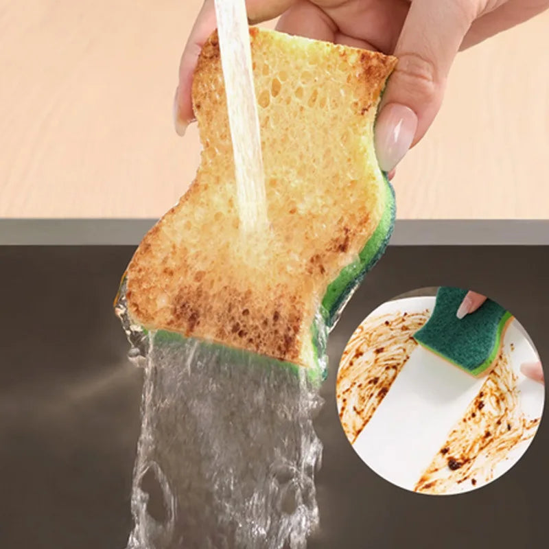 Multi-layer kitchen sponge scrub with green scrubber under running water for oil-stain removal