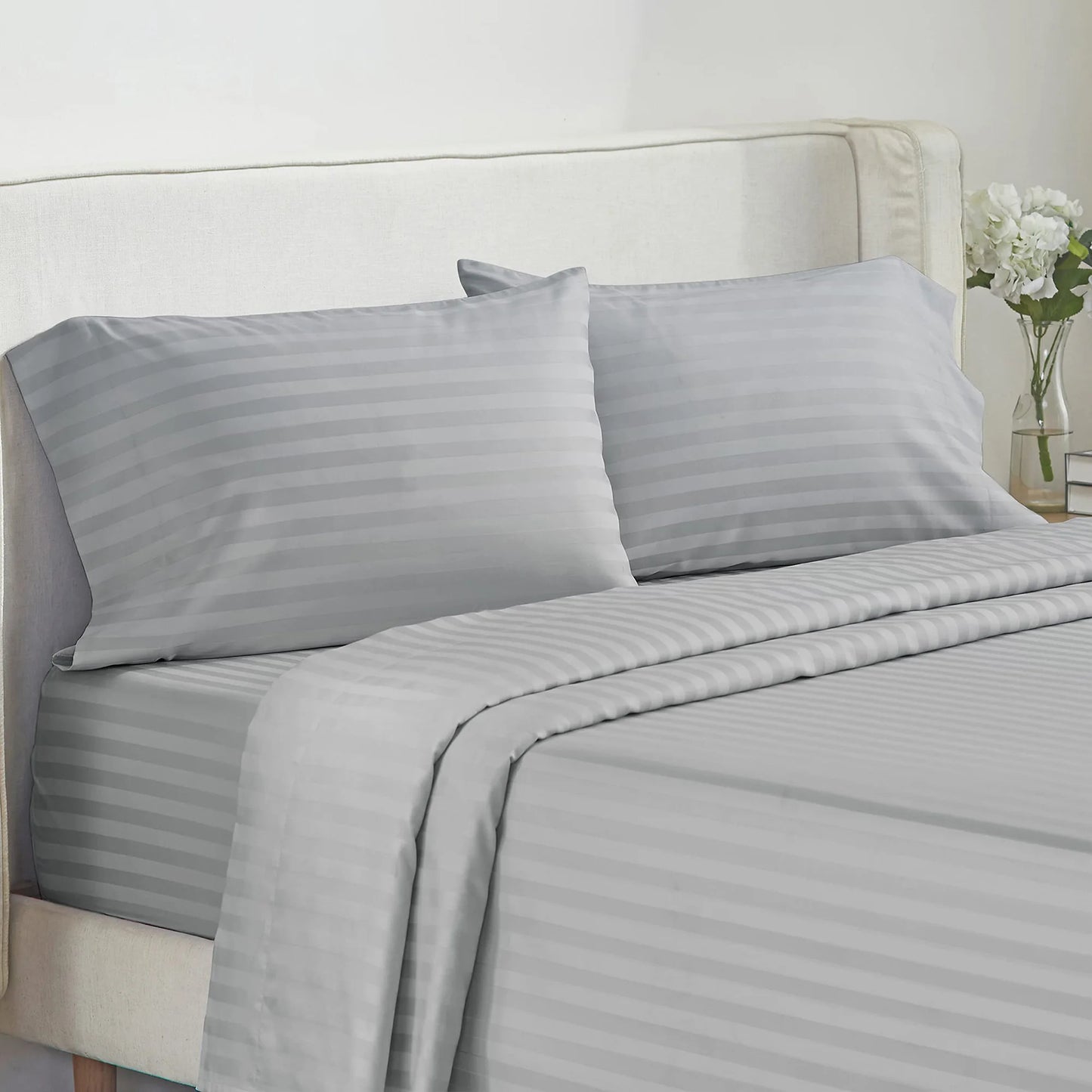 Battilo bed sheets 4-piece set with striped gray pillowcases on a neatly made bed