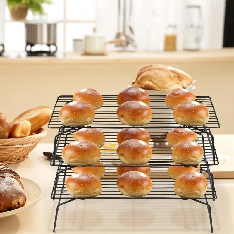 Stainless steel 3-layer foldable non-stick wire grid baking rack in black with buns on three shelves