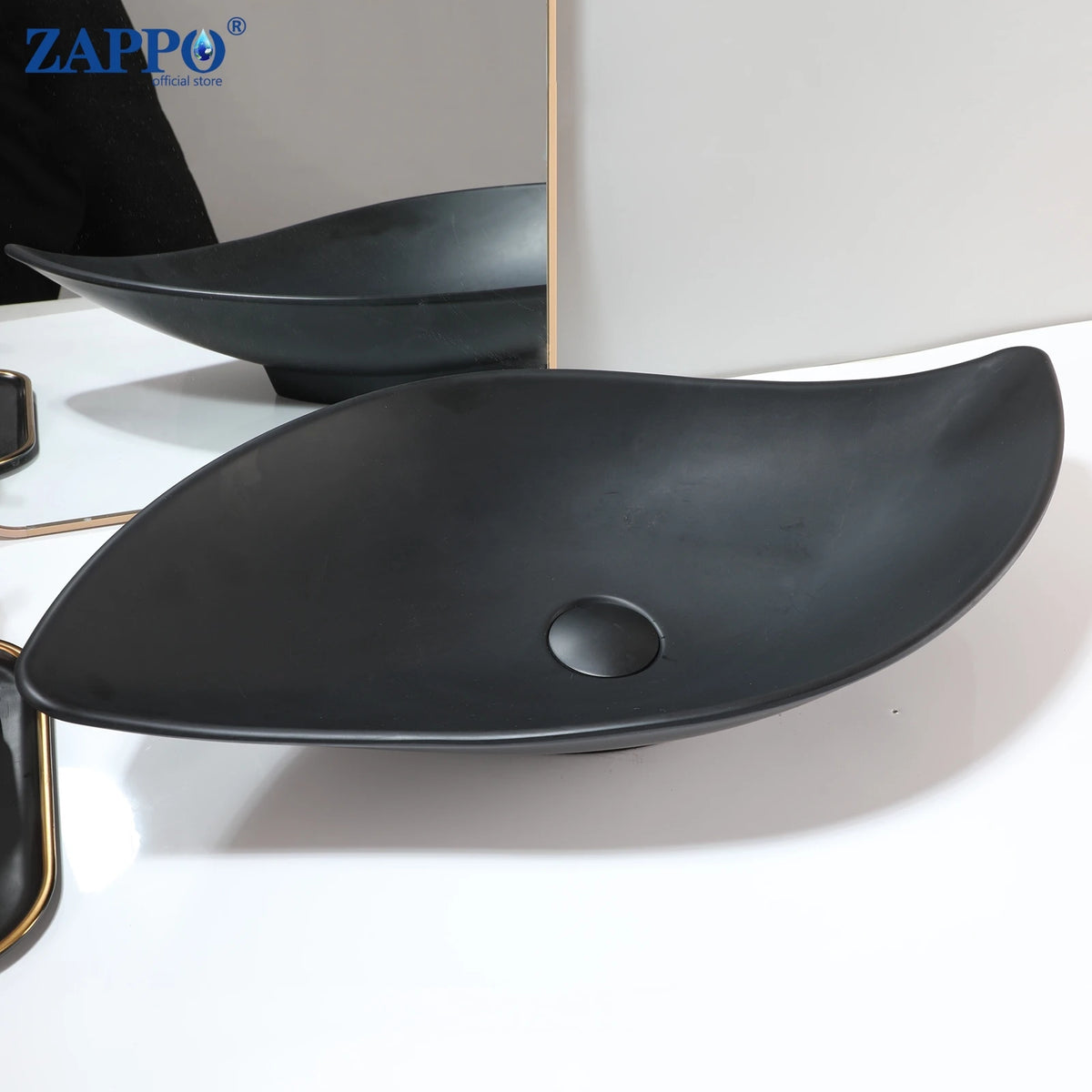 Vessel sinks pair in black stone resin with drains; ZAPPO above-counter bowls.